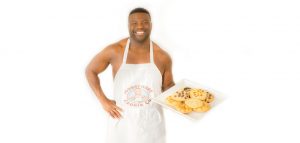 Antwain of Juggernaut Cookies holding out cookie tray